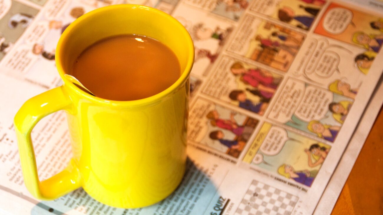 Coffee mug on newspaper comics