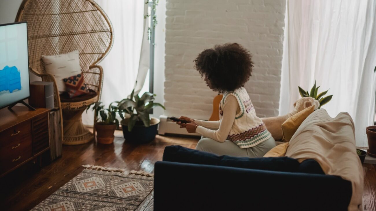 Black woman watching TV