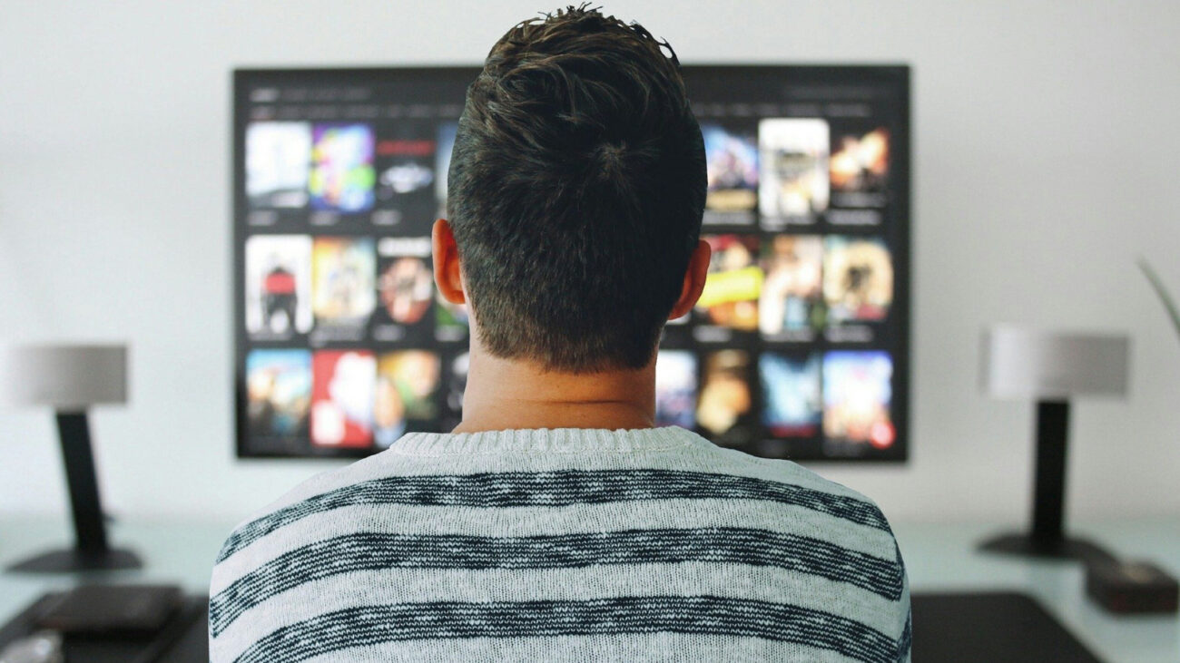 Man watching streaming service on TV