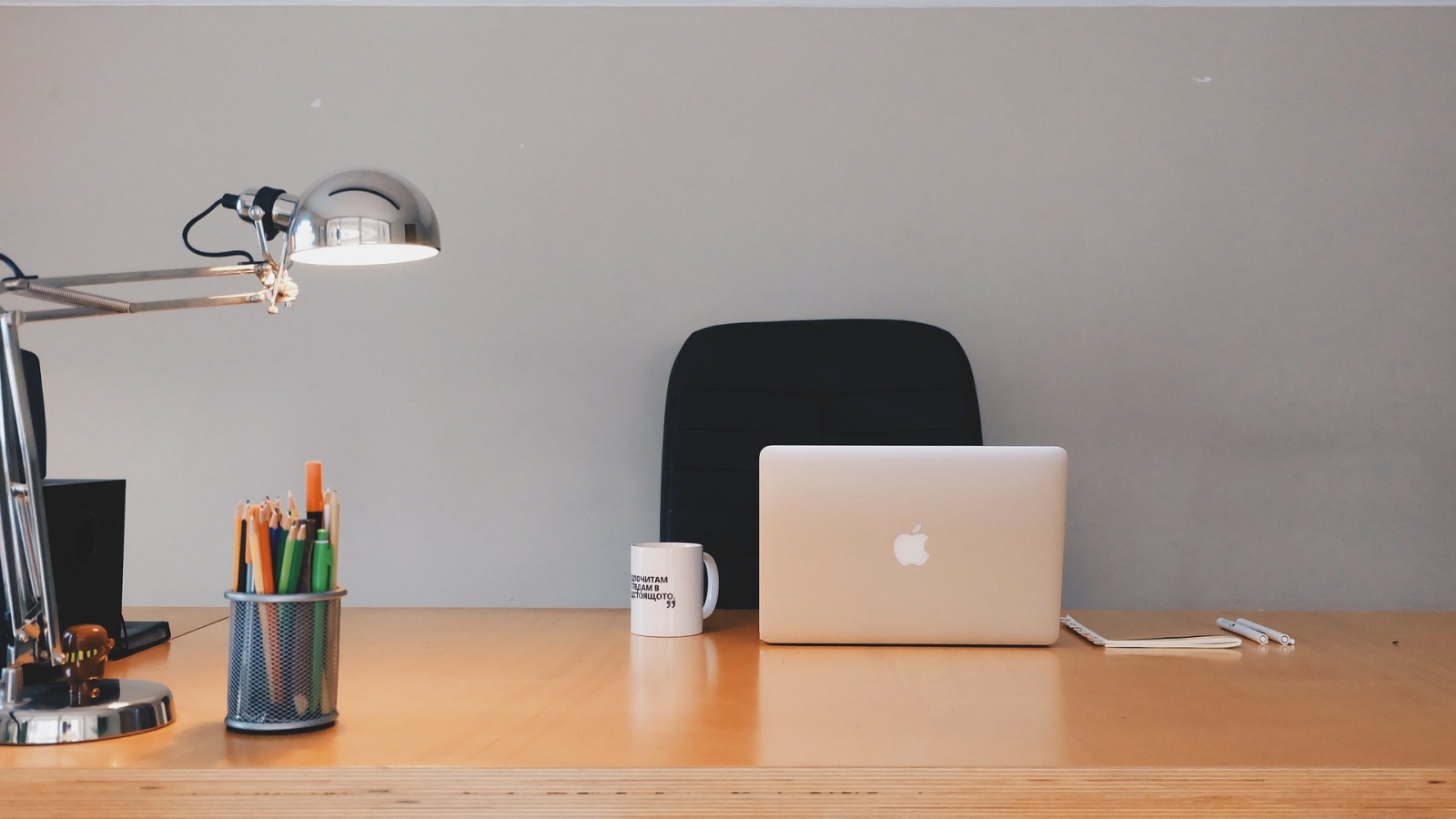 Office with desk and MacBook