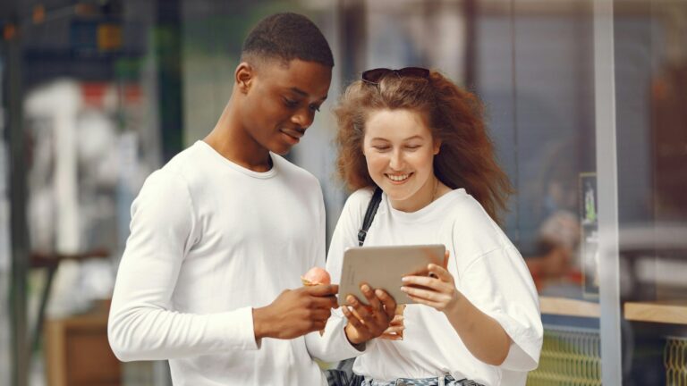 Man and woman looking at a tablet