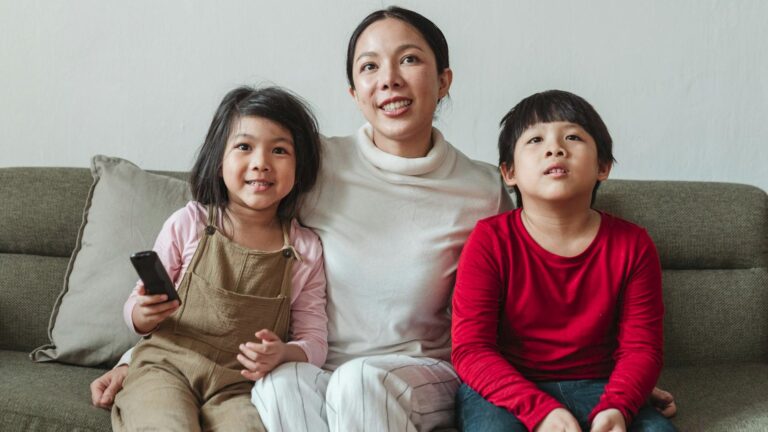 Mother and kids watching TV